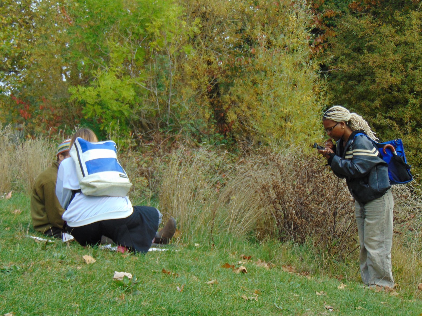 Group recording observations at the pond edge